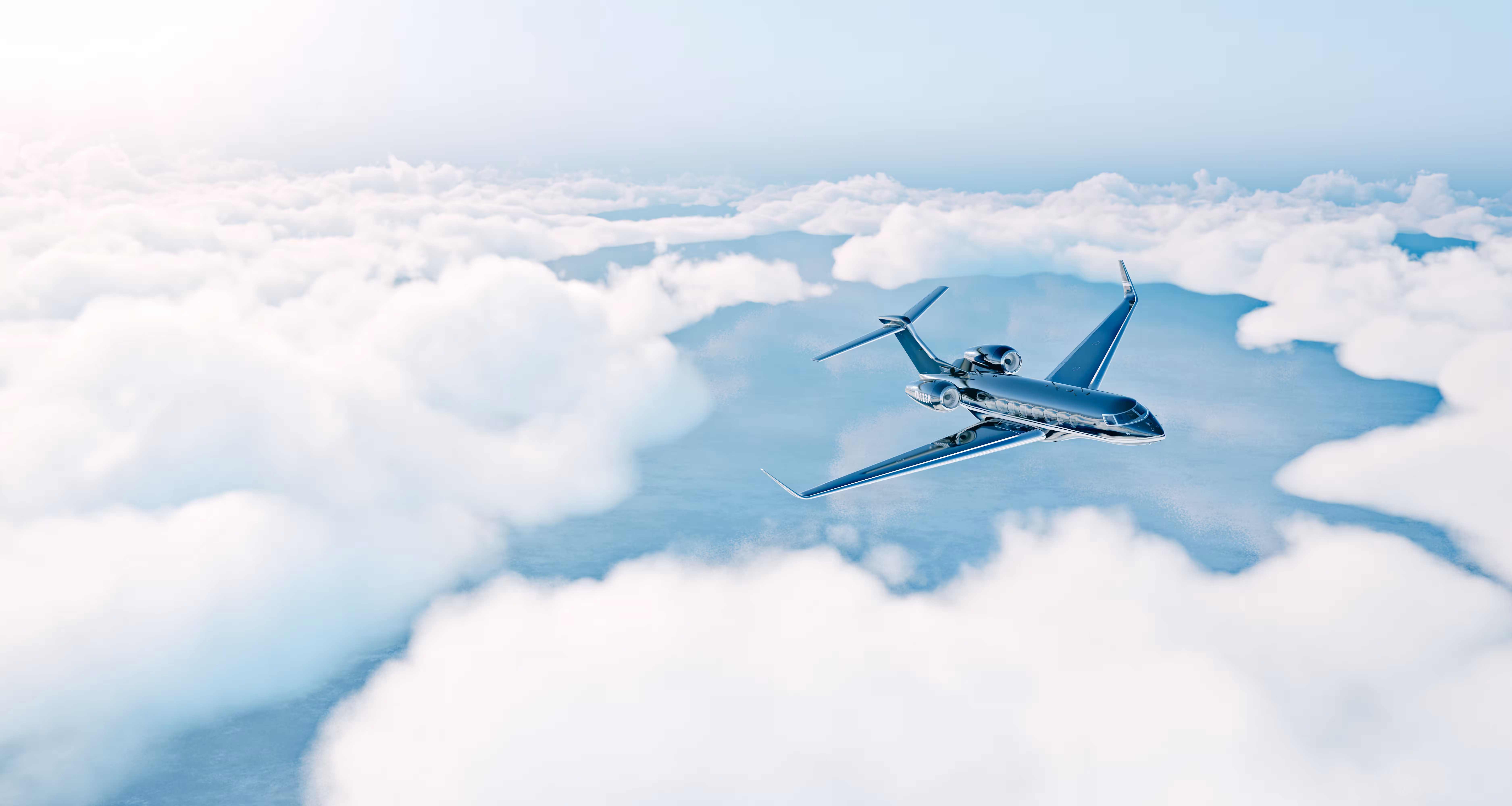 Corporate private jet cruising above white clouds in sunny blue sky